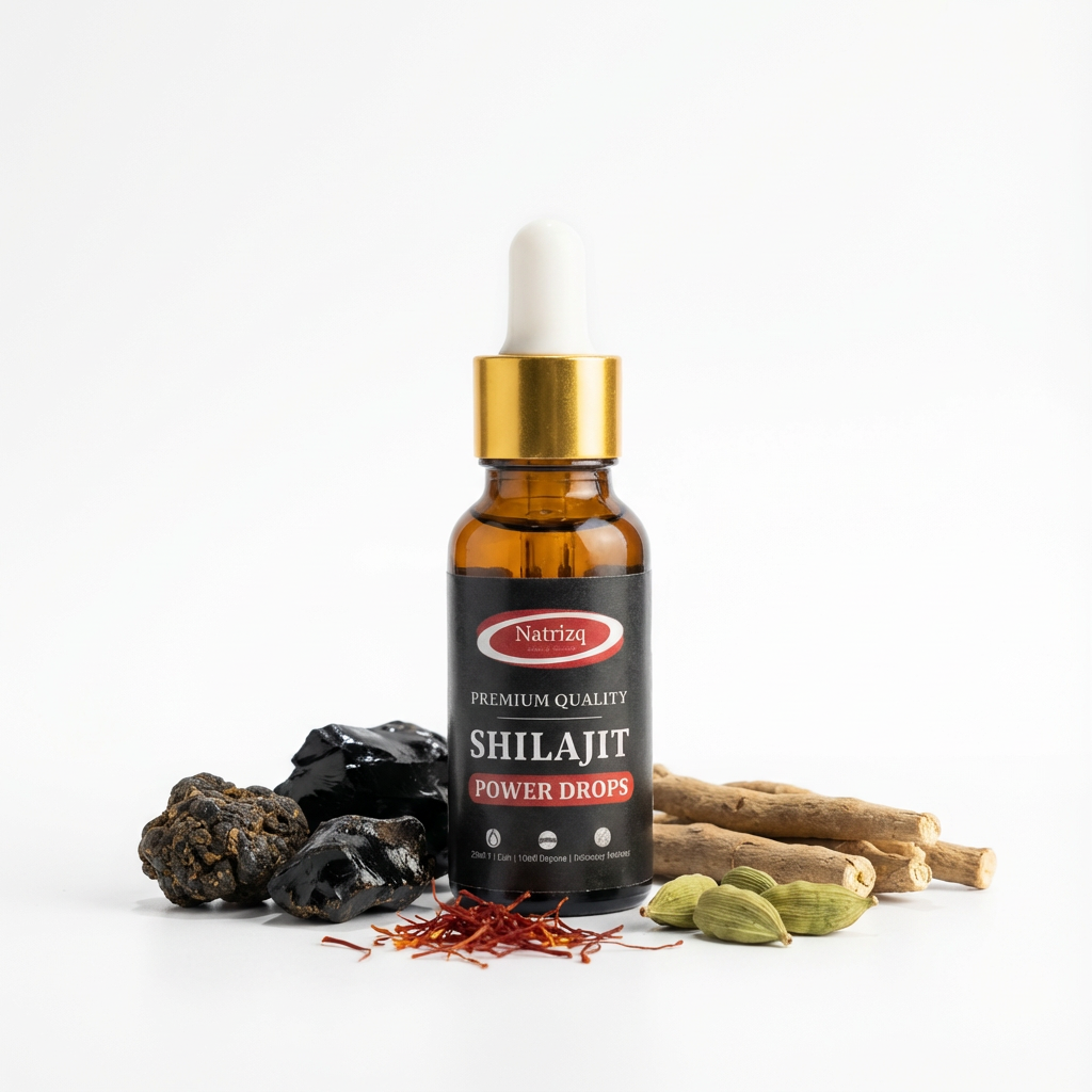 Bottle of Shilajit Power Drops with shilajit rocks and other herbs on a white background